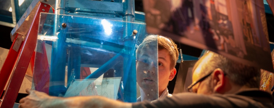 Student and facutly working on stage building.