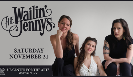 members of the wailin jennys sitting and posing at camera.