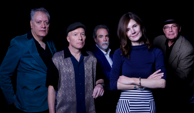 members of 10,000 maniacs posing. 