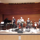 members of mingus dynasty septet performing on stage. 